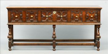 An 18th century and later oak dresser The moulded rectangular top above three geometrically