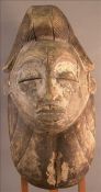 An African carved softwood tribal mask 38 cms high. Generally in good condition, expected wear, some
