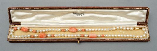 A small pearl and coral necklace With a 9 ct gold clasp. 38 cms long.
