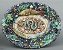 A 19th century Palissy style maiolica charger The oval body decorated with various sea creatures,