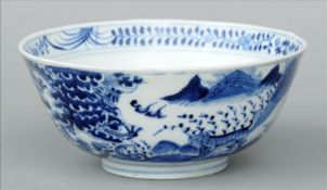 A Chinese blue and white porcelain bowl Decorated with various animals in a continuous landscape,