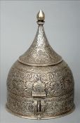 An 18th/19th century Indian Mughal white metal spice box Of helmet form, extensively decorated