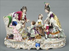 A large early 20th century Volkstedt porcelain group Modelled as three children presenting floral