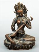 A 19th century Indian bronze figure of a deity Modelled seated, playing a stringed instrument. 19.