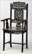 A 19th century Chinese carved hardwood faux bamboo open armchair The pierced back splat carved