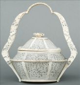 A finely carved and pierced 19th century Cantonese ivory basket and cover The florally carved