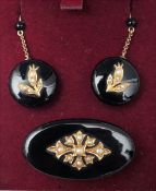 A pair of Victorian unmarked gold onyx and seed pearl drop earrings and a matching brooch The brooch