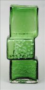 A Whitefriars green glass Drunken Bricklayer Vase designed by Geoffrey Baxter Of typical form. 34