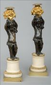 A pair of French 19th century bronze and ormolu mounted figural candelabra Each modelled as a