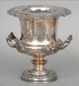 A 19th century Old Sheffield plate wine cooler Of cast twin handled urn form with fruiting vine