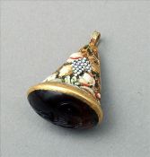 A 16th/17th century unmarked gold pendant seal The conical body cast with enamel decorated fruit