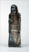 A Chinese carved hardwood figure of a sage Modelled in flowing robes holding a staff. 8.75 cms high.