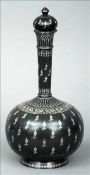 A fine quality Indian Bidri ware bottle vase and cover Typically decorated with foliate sprays and