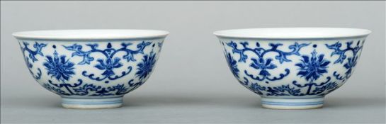A pair of Chinese blue and white porcelain bowls Each decorated with lotus strapwork, blue painted