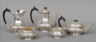 An Edwardian five piece silver tea set, hallmarked 1903-1905, maker`s mark of Goldsmith &