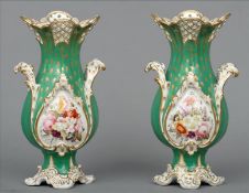 A pair of 19th century Coalport vases The pierced shaped top rim above the gilt heightened green