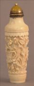 A Cantonese carved ivory snuff bottle Centrally decorated with flowers. 8 cms high. Some splits