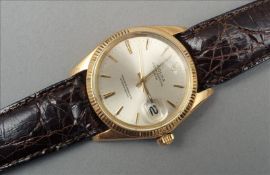 A gold Rolex Oyster perpetual wristwatch The face with date aperture and inscribed Superlative