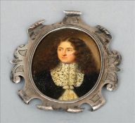 An early 17th century portrait miniature Of a gentleman wearing a laced ruff, on white metal in a