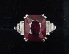 An Art Deco style 18 ct white gold diamond and ruby ring The central facet cut ruby approximately