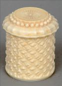 A 19th century Indian ivory box and cover The domed removable lid above a cylindrical knopped carved