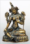 A 19th century Indian bronze figure of a deity Modelled seated. 18 cms high. Generally in good