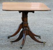 An 18th century style mahogany twin pillar dining table The rounded rectangular top incorporating