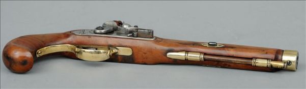 A flintlock pistol With brass and polished steel mounts and a brass mounted ramrod. 39 cms long.