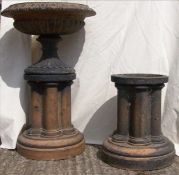 A Victorian stoneware garden urn The scalloped shaped bowl above a domed spreading base, standing on