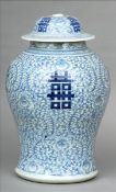 A Chinese blue and white porcelain baluster vase and cover Decorated with calligraphic script, on