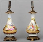 A pair of gilt metal mounted Paris type porcelain lamps The main bulbous body decorated with a young