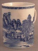 An 19th century Chinese Export porcelain mug Decorated with a continuous landscape in blue. 11.5 cms