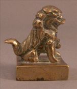 A Chinese cast bronze seal Surmounted with a dog-of-fo. 4.5 cms high. Generally in good condition,