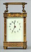 A 19th century French gilt bronze carriage clock The reeded square section swing handle above a