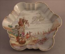 An 18th century Chinese Export lobed dish Decorated with European scenes. 13 cms wide. Some gilt