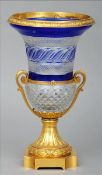 A Continental ormolu mounted blue flashed cut glass twin handled vase Of campana form with hob