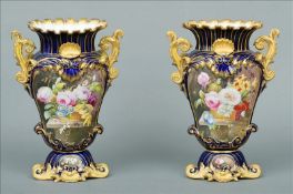 A pair of 19th century hand painted Coalport vases The gilt heightened castellated neck rim above