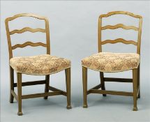 A set of six 19th century painted ladder back dining chairs The shaped top rail above twin