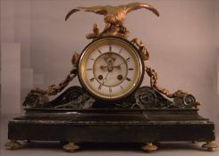 A 19th century ormolu mounted marble and black slate mantel clock The cylindrical dial inscribed T.