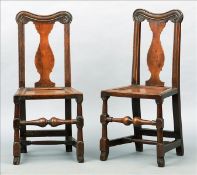 A set of seven 18th century ash dining chairs The carved shaped top rail above vase shaped central