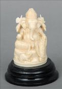 A 19th/20th century Indian carved ivory figure of Ganesh Typically modelled, on an ebonised plinth