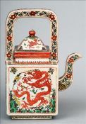 A Chinese earthenware teapot Of square sectional form, decorated with dragons, the underside with