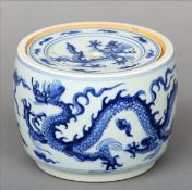 A Chinese porcelain fighting cricket pot and cover Of cylindrical section, decorated with five-