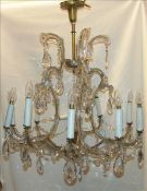 A Venetian cut crystal chandelier The five twin branches each issuing a faux candle and set with