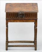 An 18th century and later oak bible box on stand The sloping moulded rectangular top above an open
