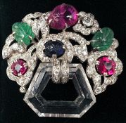An unmarked white gold, diamond, ruby, emerald, emerald sapphire and rock crystal set brooch, in the