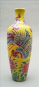 A Chinese porcelain miniature vase Of slender form, decorated with a phoenix among floral sprays