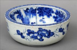A Chinese blue and white porcelain bowl The interior decorated with landscape vignettes, the