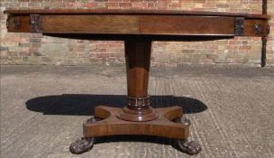 A 19th century rosewood writing table. The twin flap shaped top with two frieze drawers.