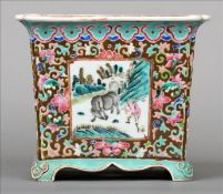 A late 19th century Chinese porcelain jardiniere Of square section, decorated with figural vignettes